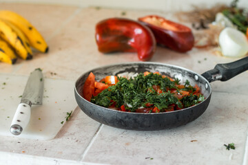 detailed view of a pan with chopped vegetables, ready to prepare a stew for lunch.