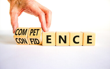 Competence and confidence symbol. Concept word Competence Confidence on wooden cubes. Businessman...