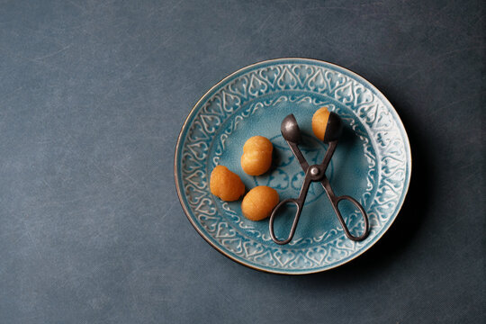 Cantaloupe on a Blue Plate with Vintage Fuit Baller
