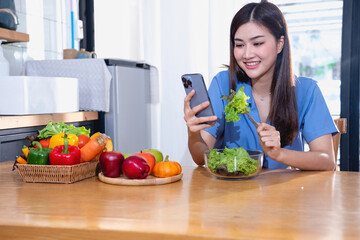 Diet, white-skinned young Asian woman in a blue shirt eating vegetable salad and apples as a healthy diet, opting for junk food. Female nutritionist losing weight. healthy eating concept.