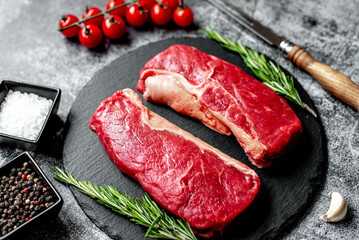 raw beef steak on stone background