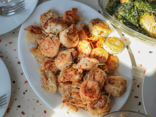Chicken rolls in a dish on the table.