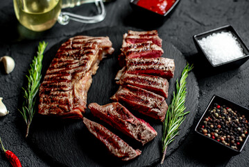 grilled beef steak on stone background