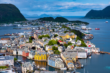 View of colorful Art Nouveau architecture in the port of the city of Alesund from the mountain...