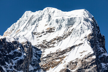 Detail of frozen and snowy summit of Tobuche "Taboche" (6495m) seen from Pangboche during Three passes trek