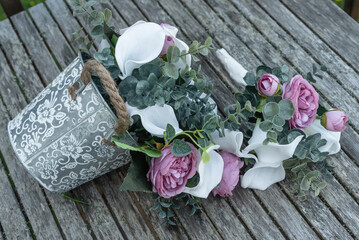 Flowers in A Silver Antique Bucket