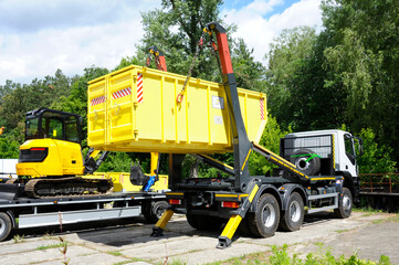 Radioactive waste storage container loading on a truck crane platform
