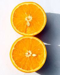 Slices of fresh orange on a white background, top view

