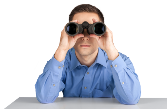 Business man holding binoculars isolated on white background