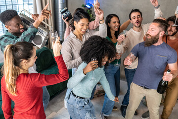 Large group of people organize a party with music and dance in a private house, young people having fun at celebration party
