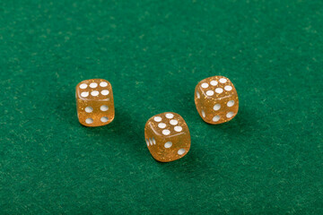 Three Yellow Dice on Green Velvet Casino Table for Gaming and Gambling, 6,6,6