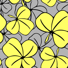 Obraz na płótnie Canvas seamless asymmetric pattern of clover leaves in yellow-gray tones and black contouros, design, texture