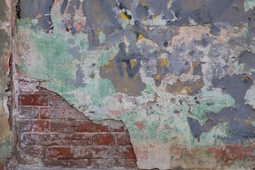 Old painted rouge worn brick wall 