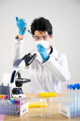 Laboratory assistant conducting experiments for laboratory research.