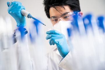 Laboratory assistant conducting experiments for laboratory research.