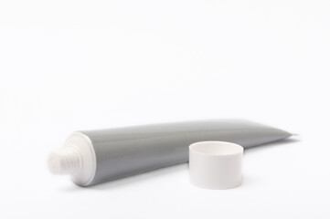  Tube of toothpaste isolated on white background. Close-up. Prevention of dental plaque and caries. Fresh breath. Dentistry concept. Oral care.