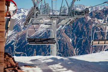 Fototapeta premium Cable car in the beautiful winter snow mountains.