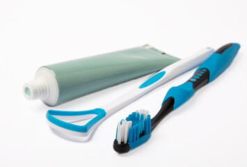 Tube of toothpaste and toothbrush isolated on white background. Close-up. Prevention of dental plaque and caries. Fresh breath. Dentistry concept. Oral care.