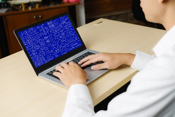 Mathematic equations and modish formula on computer screen showing concept of science and education