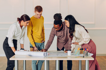 Diverse group of engineers or architects having a meeting in an office