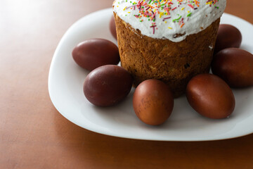 Easter cake and colored eggs. Traditional Easter baking. Easter holiday. Close-up.