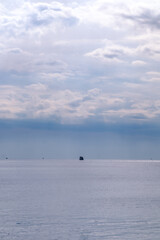 Boat in the middle of the Meditarranean sea during a cloudy day