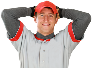 Portrait of handsome young male baseball player looking at camera isolated on white