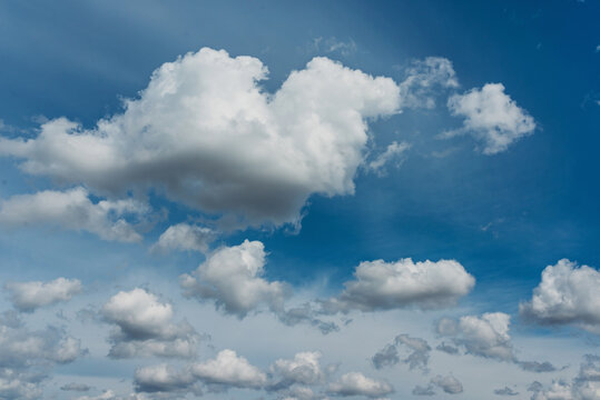 Blue sky with white clouds and heart from cloud.