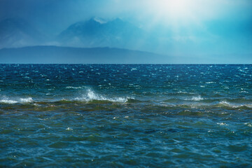 Issyk-Kul lake at strong wind with mountains view, Kyrgyzstan