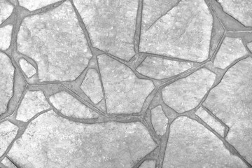 Crazy paving floor texture background.  Black and white photography. 