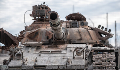 Plakat damaged military tank on a city street in Ukraine
