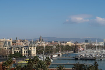 Fototapeta na wymiar Skyline of Barcelona seen from a boat in the harbor