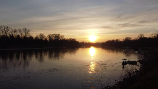 Sunset at Casa sul fiume beach on Ticino river in Pavia, Italy