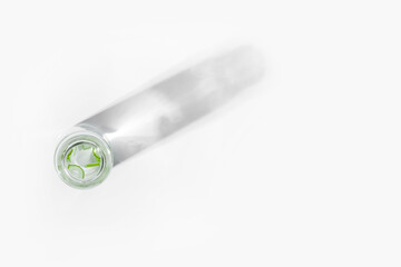 organic cosmetics, natural cosmetics, biofuels, algae. Natural green laboratory. Experiments. Glass laboratory jar with green plants on a light background.