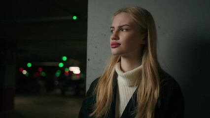 Scared Caucasian woman girl in dangerous dark parking female driver client wait taxi frightened upset stressed lady businesswoman alone in car garage underground shelter looking away confusion doubt