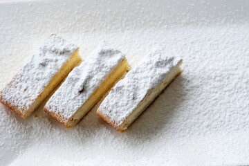 Sweet bakery - cottage cheese pie on gray stone background. Baked cheesecake in rustic style on stone table. Aesthetic composition with cottage pie. Cottage cheese tart. High quality photo