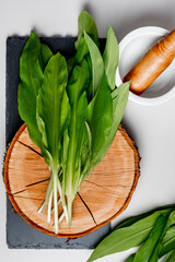 Wild garlic. Wild garlic on a wooden board on a table.