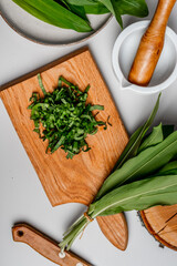 Wild garlic. Wild garlic on a wooden board on a table.