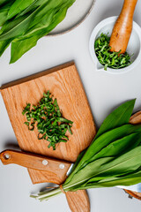 Wild garlic. Wild garlic on a wooden board on a table.