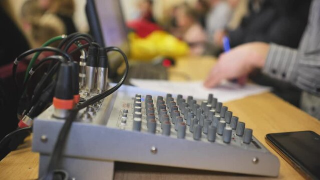 The mixing console on the sound engineer's desk during the event.