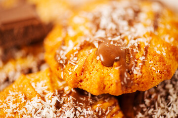 Fresh-baked Snickerdoodle cookies with chocolate and shredded coconut.