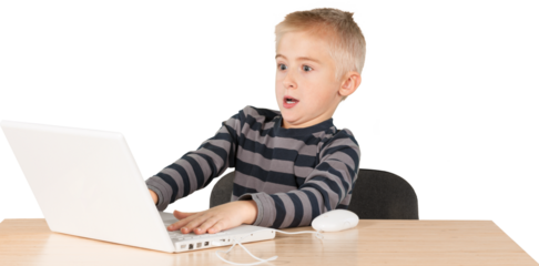 Young boy palying game on a latop and leaning way back