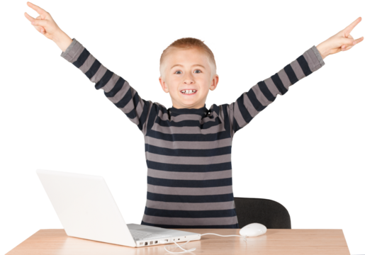 Young boy celebrating with open arms over laptop on desk