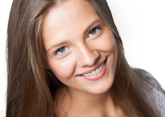 Close up portrait of a beautiful girl looking at camera on a white background