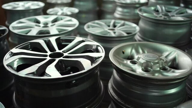 closeup of car alloy wheel in tire store or warehouse stock