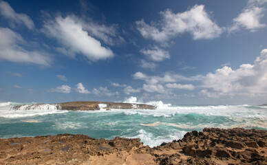 Choppy storm waves crashing into Laie Point coastline at Kaawa on the North Shore of Oahu Hawaii United States