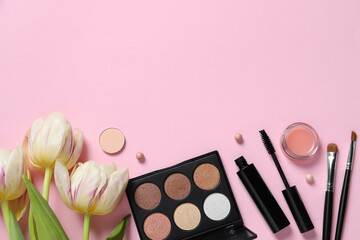 Obraz na płótnie Canvas Flat lay composition with different makeup products and beautiful tulips on pink background. Space for text
