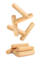 Fresh raw sausages falling on white background