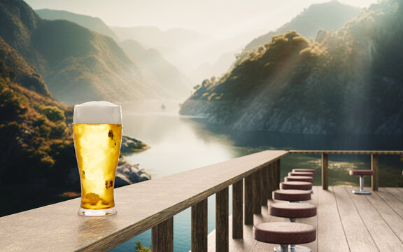 Draft or craft beer in clear glass with beer foam on top Put on set of wooden tables. Restaurant terrace by the river in the middle of the mountains. 3D Rendering.