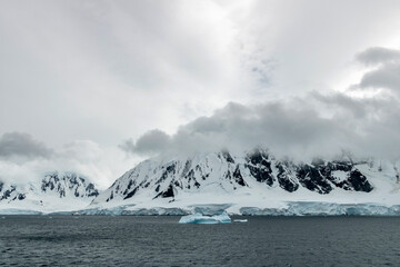 Sailing around a bend in the Neumayer Channel in Antarctica